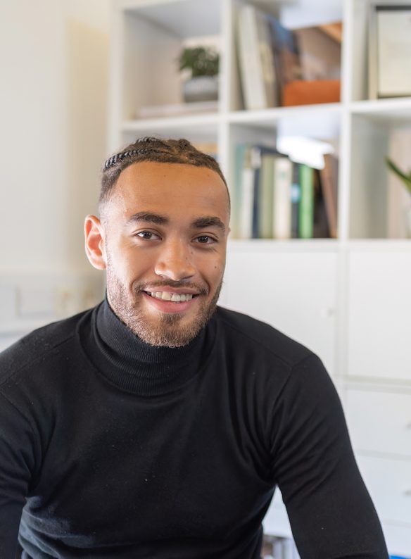 Jordan Dunkley, man sat down smiling