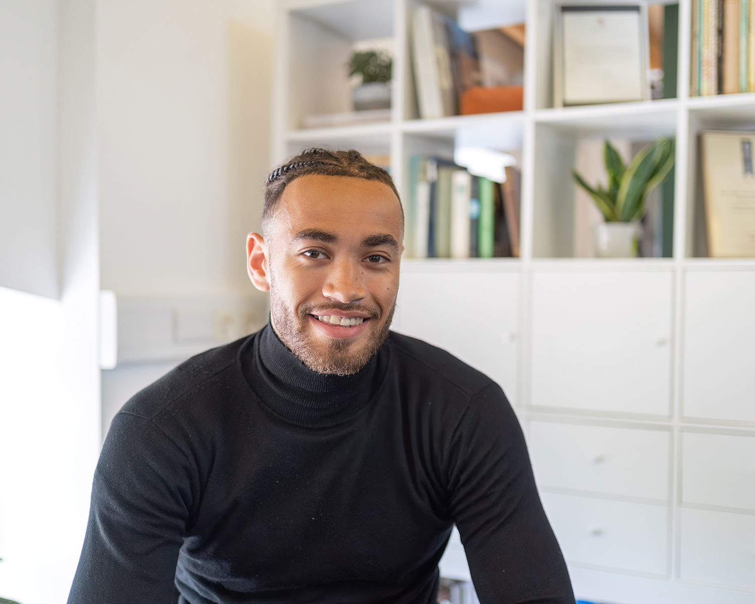 Jordan Dunkley, man sat down smiling