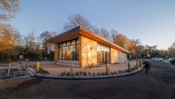 view of welcome centre at dusk with car park to right